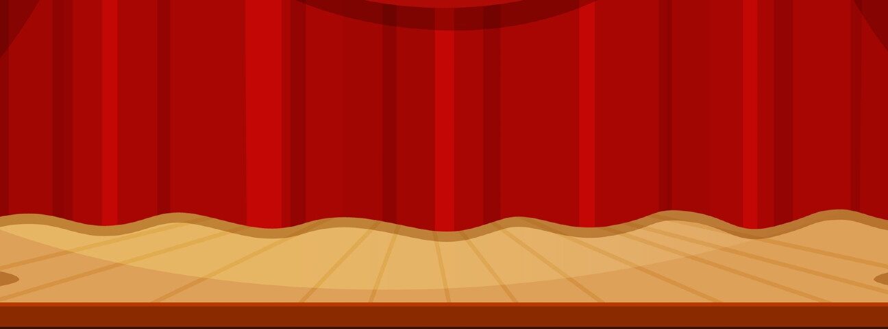 Theater stage with open red curtains