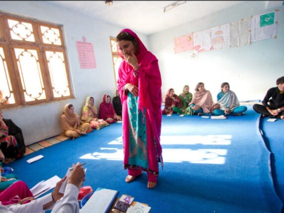 Youth of the Garam Chashma valley contribute their monthly savings to the Community Based Saving Group (CBSG). The initiative helps them save money and socialize with their fellow youths." Credit: Aga Khan Foundation