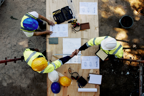 People on construction site shaking hands in collaboration. Credit: Jacob Wackerhausen