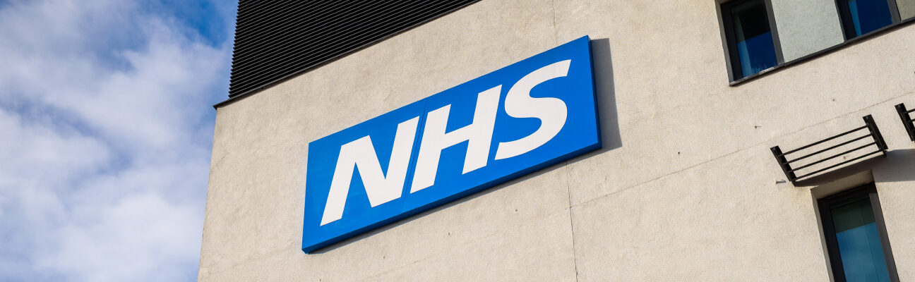 View of the NHS (National Health Service) logo at the Springfields Medical Centre in the centre of Warrington, Cheshire. Credit: Marbury