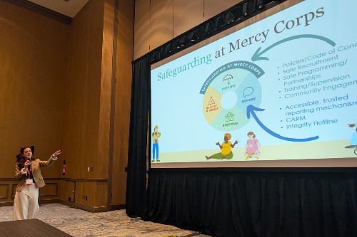 Laura Ragan presents at the the 21st Annual Conference on Crimes Against Women in Dallas, Texas. Credit: Mercy Corps