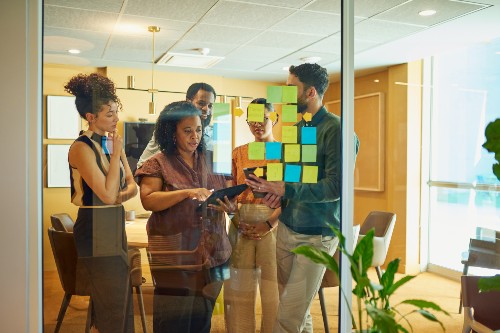 People collaborating in a meeting room.